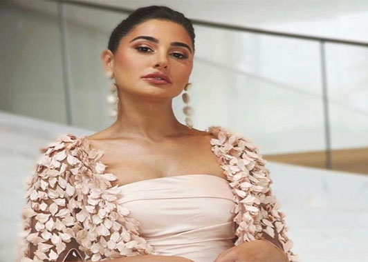Nargis Fakhri drops another regal look and exudes charm in a peach gown; PICS